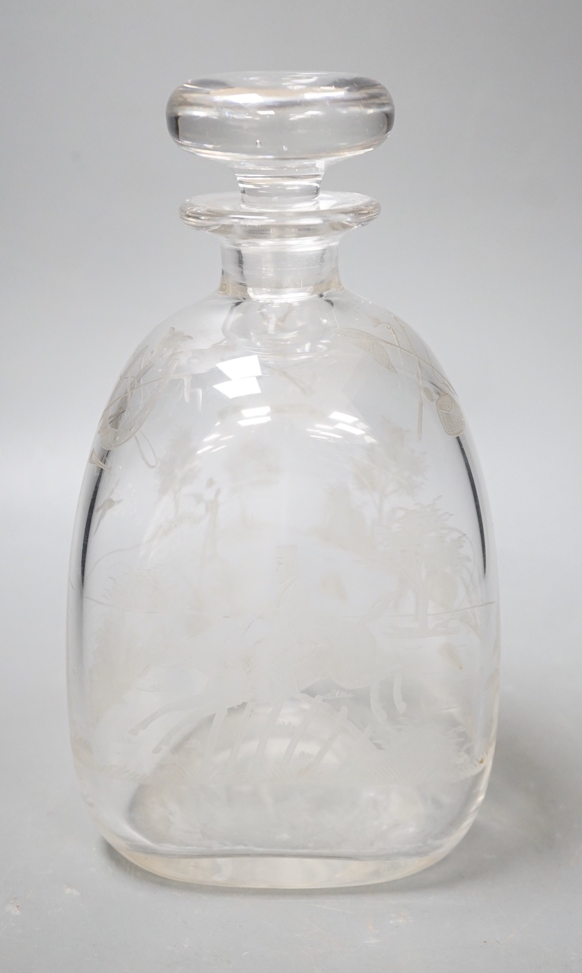 Hunting interest - A Victorian wheel engraved triangular glass decanter, and stopper. 22cm tall